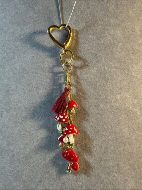 Hand Crafted Gold Tone Heart Keychain with Red Mushroom Charms and red tassel